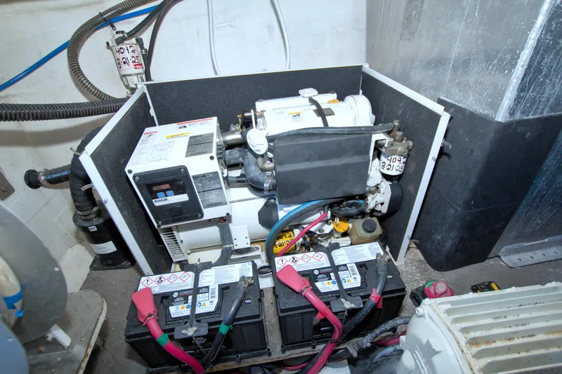 Serenity In The Sea Yacht Photos Pics Engine room of 2014 Regal 46 Sport Coupe with generator and batteries.