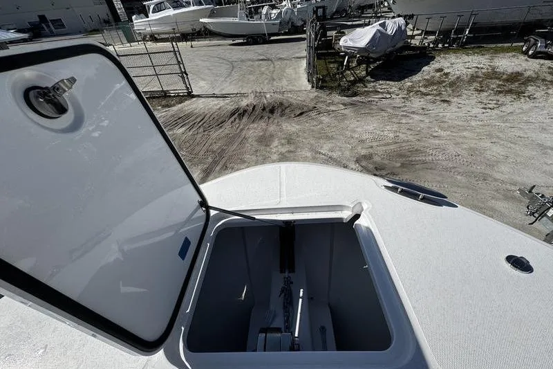  Yacht Photos Pics Open hatch on 2026 Southport 33 DC boat, showing storage compartment.