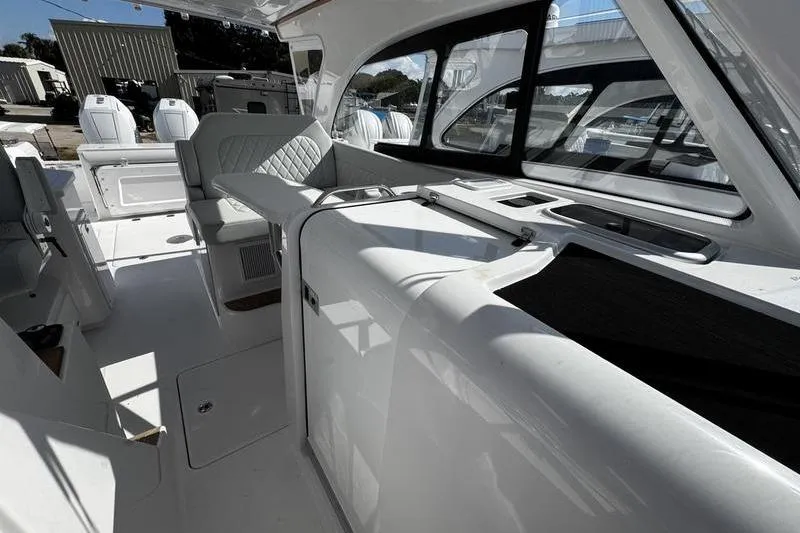  Yacht Photos Pics 2026 Southport 33 DC boat interior with modern seating and sleek design.