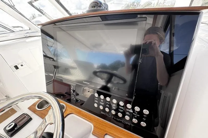  Yacht Photos Pics Helm of 2026 Southport 33 DC boat with Garmin display and controls.
