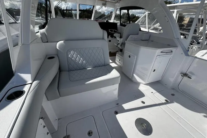  Yacht Photos Pics 2026 Southport 33 DC boat interior with white seating and modern design.