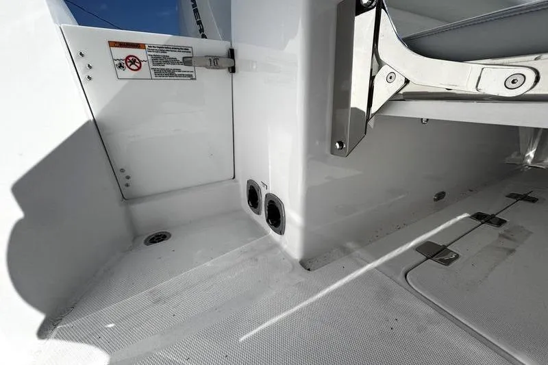  Yacht Photos Pics 2026 Southport 33 DC boat interior detail with storage compartments and safety labels.