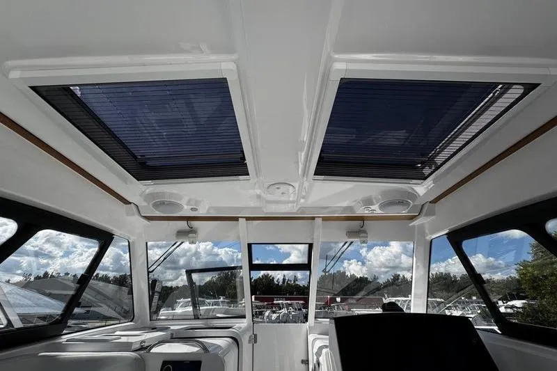  Yacht Photos Pics Interior view of 2026 Southport 33 DC boat with skylights and panoramic windows.