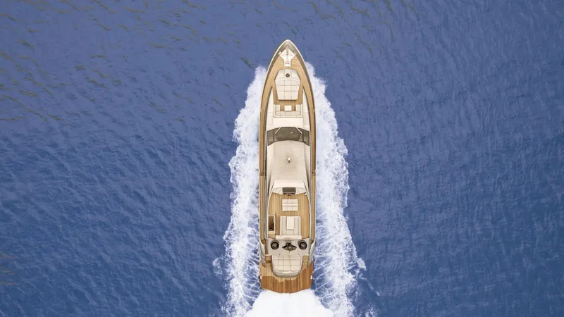  Yacht Photos Pics Aerial view of 2012 Pershing 92 yacht cruising on open blue sea.
