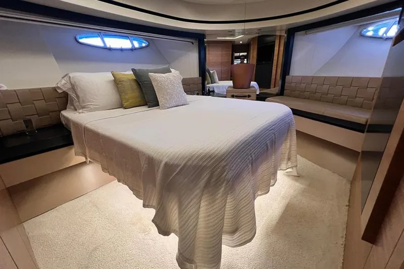  Yacht Photos Pics Luxurious bedroom interior of a 2012 Pershing 92 yacht with elegant bedding.
