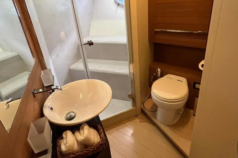  Yacht Photos Pics Bathroom interior of 2012 Pershing 92 yacht with sink, toilet, and shower.