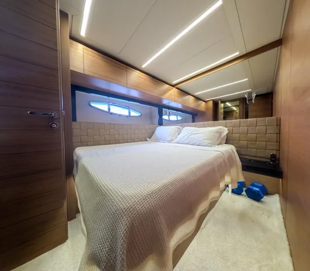  Yacht Photos Pics Luxurious bedroom interior of 2012 Pershing 92 yacht with modern design and cozy bedding.