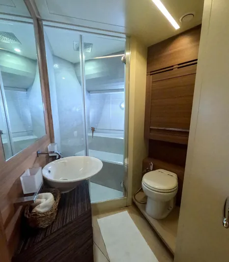  Yacht Photos Pics Luxurious bathroom in a 2012 Pershing 92 yacht with modern fixtures and elegant design.