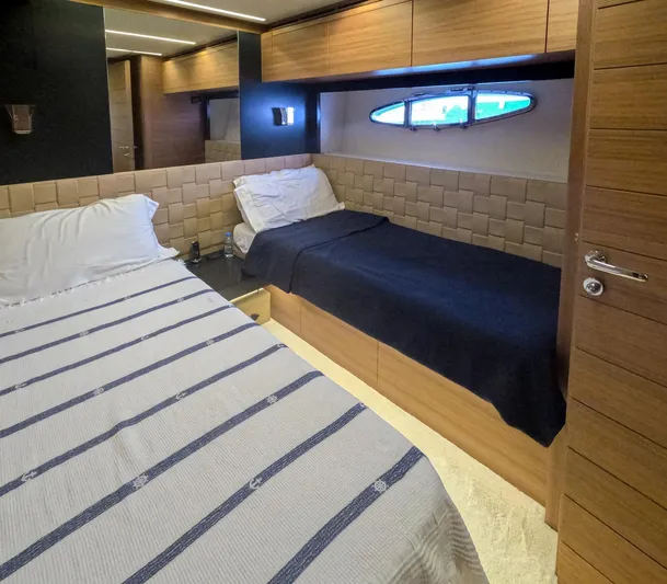  Yacht Photos Pics Luxurious cabin interior of 2012 Pershing 92 yacht with twin beds and modern design.