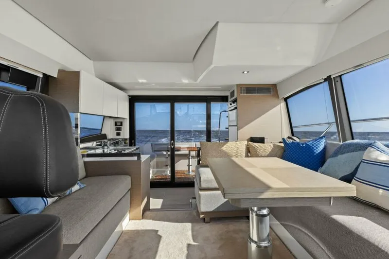 Brace Yourself Too Yacht Photos Pics Luxurious interior of 2022 Prestige 460 yacht with modern seating and ocean view.
