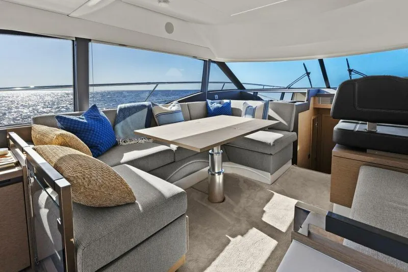 Brace Yourself Too Yacht Photos Pics Luxurious interior of 2022 Prestige 460 yacht with elegant seating and ocean view.