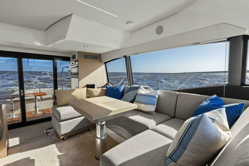 Brace Yourself Too Yacht Photos Pics Luxurious interior of 2022 Prestige 460 yacht with ocean view and plush seating.