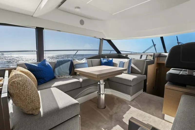 Brace Yourself Too Yacht Photos Pics Luxurious interior of 2022 Prestige 460 yacht with ocean view and modern seating.
