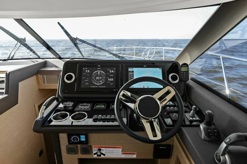 Brace Yourself Too Yacht Photos Pics Cockpit of 2022 Prestige 460 yacht with modern navigation controls and ocean view.