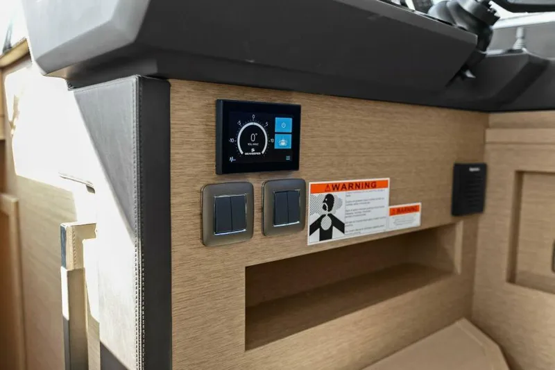 Brace Yourself Too Yacht Photos Pics Control panel of a 2022 Prestige 460 yacht with warning label and switches.