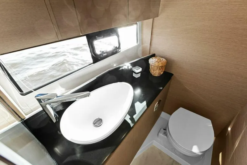 Brace Yourself Too Yacht Photos Pics Luxurious bathroom in 2022 Prestige 460 yacht with modern sink and toilet.