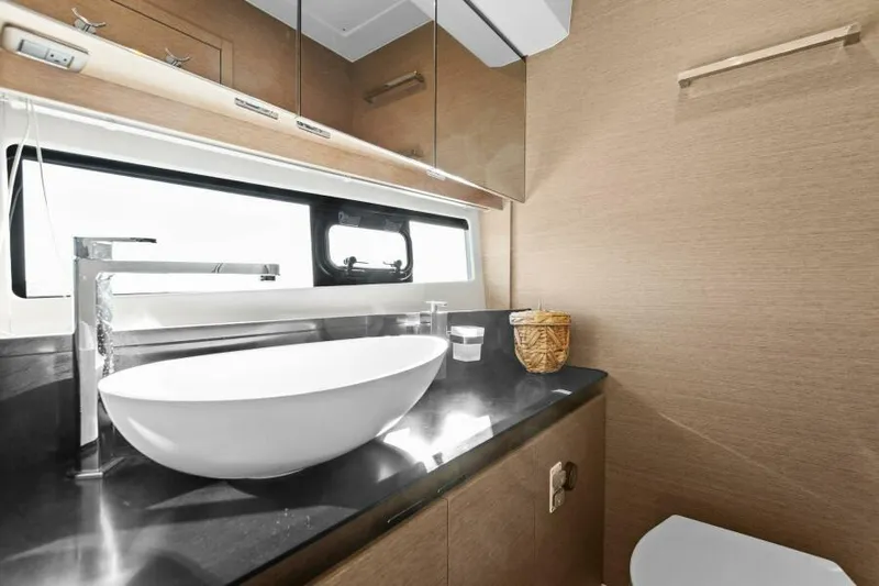 Brace Yourself Too Yacht Photos Pics Luxurious bathroom interior of 2022 Prestige 460 yacht with modern sink and sleek design.