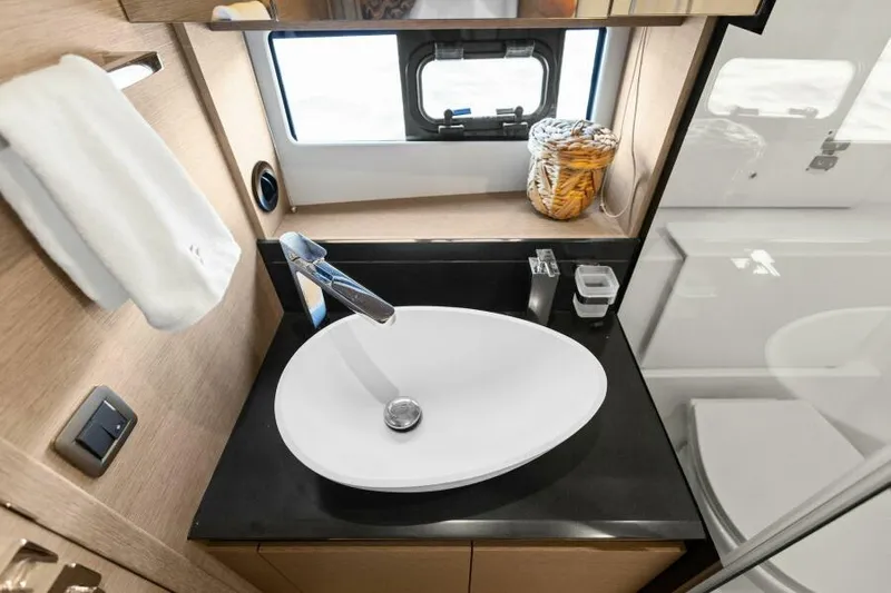 Brace Yourself Too Yacht Photos Pics Luxurious bathroom sink in 2022 Prestige 460 yacht, featuring modern design and elegant fixtures.