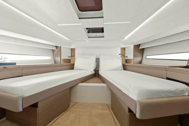 Brace Yourself Too Yacht Photos Pics Luxurious twin cabin interior of 2022 Prestige 460 yacht, featuring modern design and comfortable bedding.
