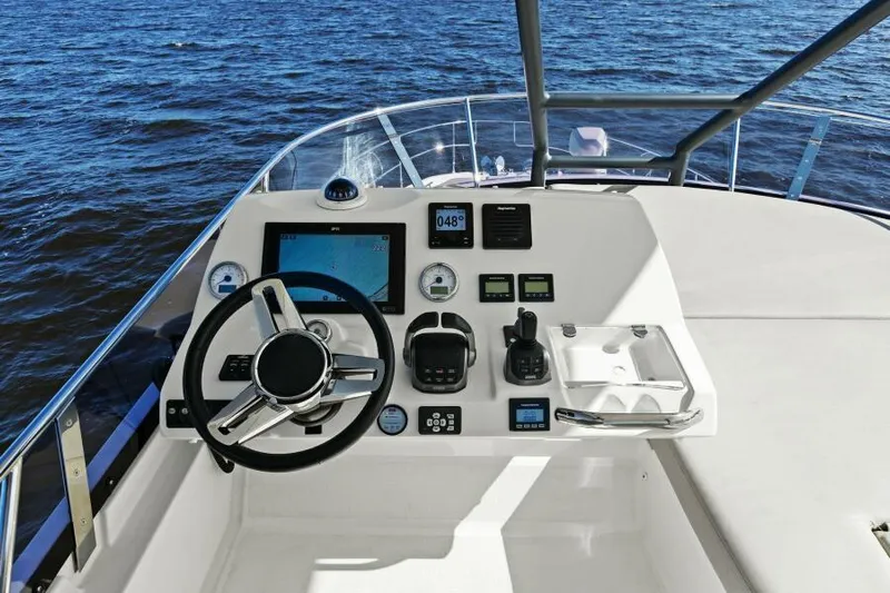 Brace Yourself Too Yacht Photos Pics Prestige 460 yacht helm, 2022 model, featuring modern navigation controls on open water.