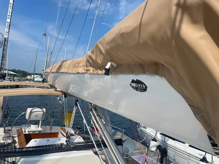 Bell Canto Yacht Photos Pics Sailboat Tartan 3400, 2006 model, docked with beige sail cover, clear sky background.