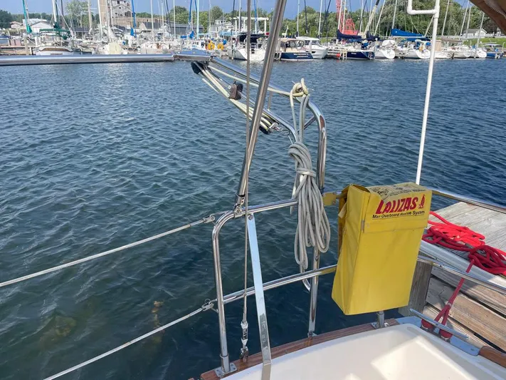 Bell Canto Yacht Photos Pics Sailboat Tartan 3400 (2006) docked at marina, featuring safety equipment and coiled rope.
