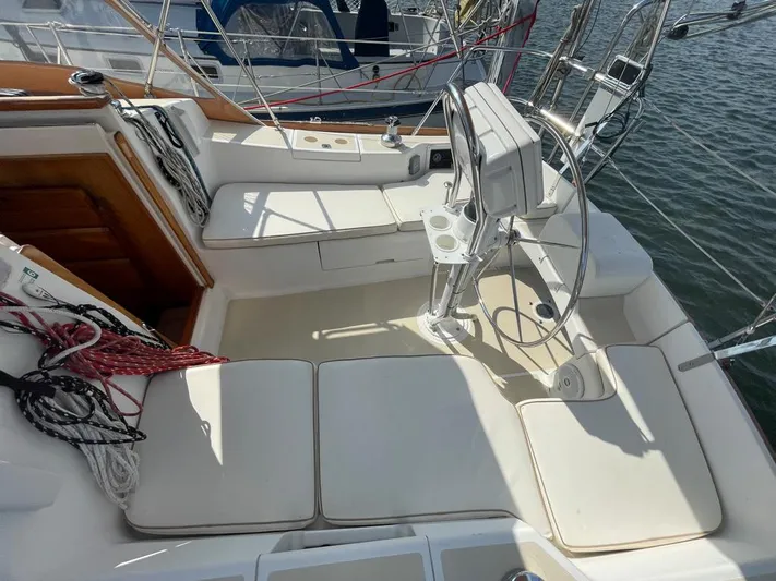 Bell Canto Yacht Photos Pics Cockpit of 2006 Tartan 3400 sailboat with steering wheel and seating.