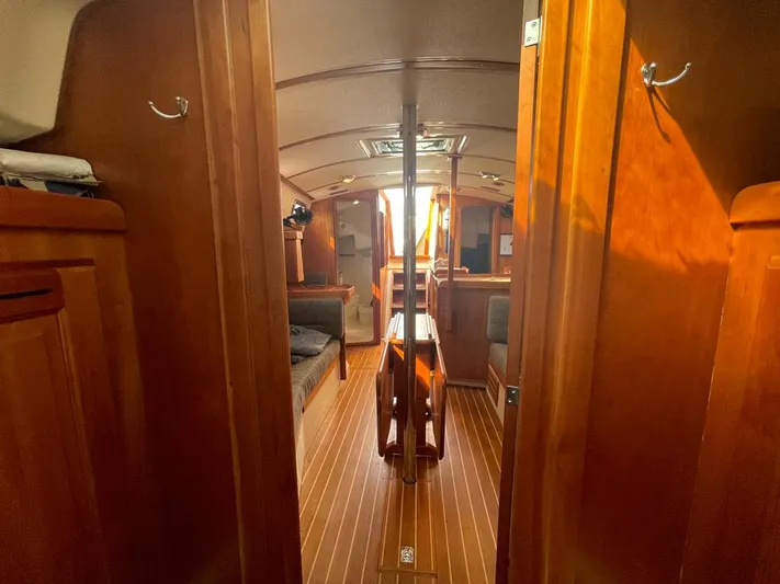Bell Canto Yacht Photos Pics Interior of 2006 Tartan 3400 sailboat with wooden finish and cozy seating area.