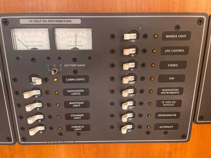 Bell Canto Yacht Photos Pics Control panel of a 2006 Tartan 3400 sailboat with various switches and gauges.