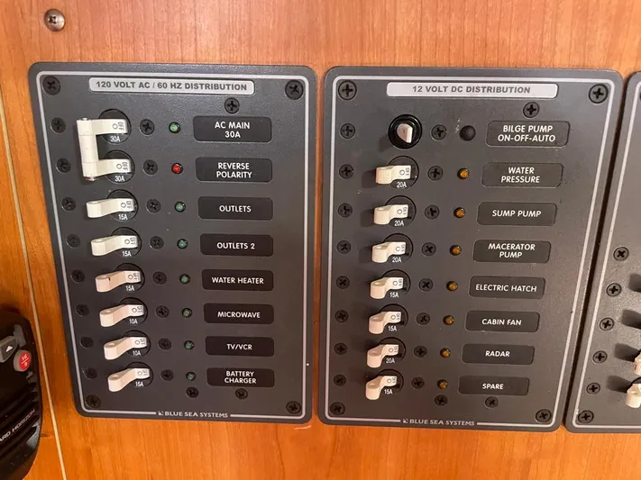 Bell Canto Yacht Photos Pics Electrical panel on a 2006 Tartan 3400 boat, featuring AC and DC distribution switches.