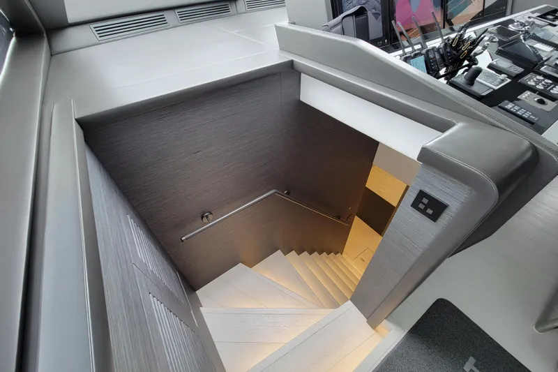Nana I Yacht Photos Pics Interior staircase of 2020 Mangusta 110 Open yacht, featuring modern design and controls.