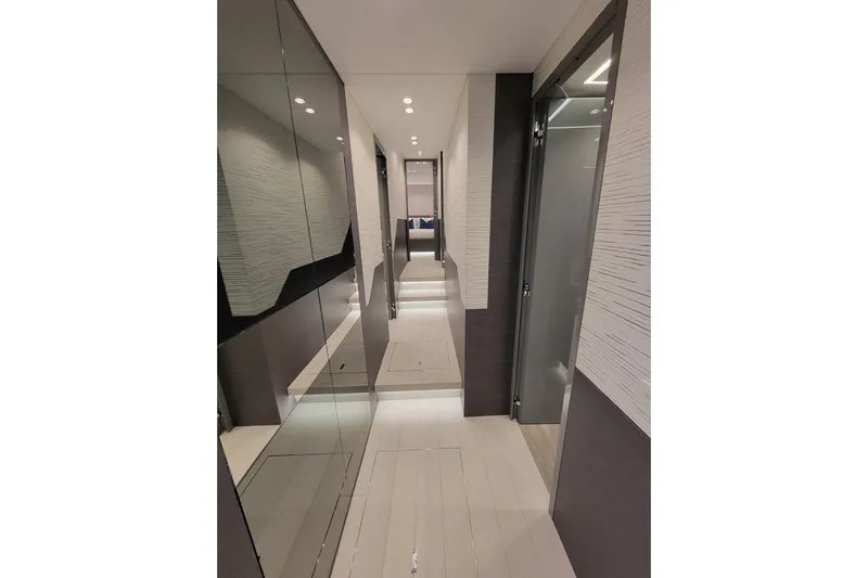 Nana I Yacht Photos Pics Luxurious interior hallway of 2020 Mangusta 110 Open yacht with modern design elements.