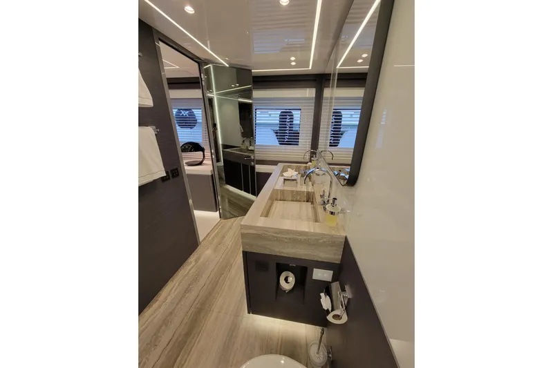 Nana I Yacht Photos Pics Luxurious bathroom interior of 2020 Mangusta 110 Open yacht with modern fixtures.