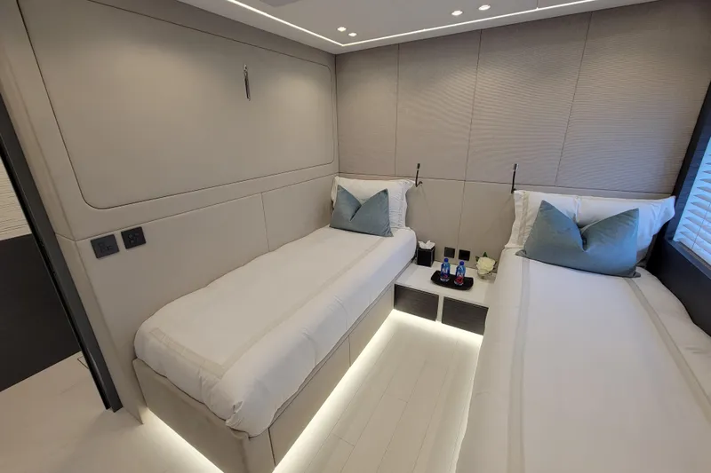 Nana I Yacht Photos Pics Luxurious twin cabin interior of 2020 Mangusta 110 Open yacht, featuring modern design and ambient lighting.