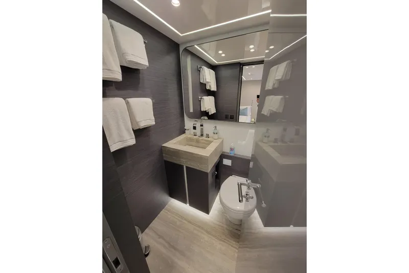 Nana I Yacht Photos Pics Luxurious bathroom in 2020 Mangusta 110 Open yacht, featuring modern fixtures and elegant design.