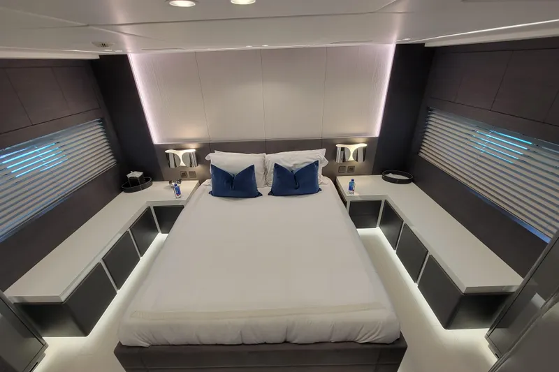 Nana I Yacht Photos Pics Luxurious bedroom interior of 2020 Mangusta 110 Open yacht with modern design and ambient lighting.