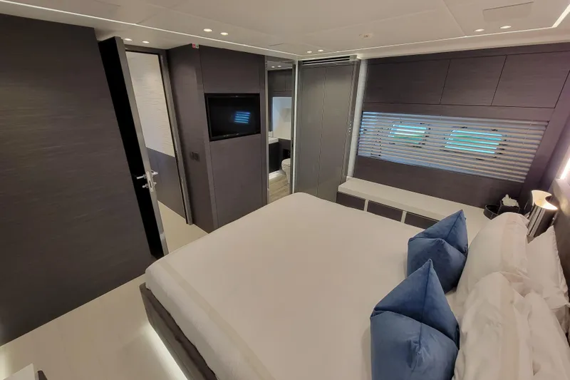 Nana I Yacht Photos Pics Luxurious bedroom interior of 2020 Mangusta 110 Open yacht with modern design and elegant furnishings.