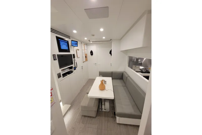 Nana I Yacht Photos Pics Luxurious interior of 2020 Mangusta 110 Open yacht with modern seating and entertainment system.