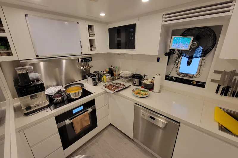 Nana I Yacht Photos Pics Modern kitchen in 2020 Mangusta 110 Open yacht, featuring sleek appliances and organized workspace.