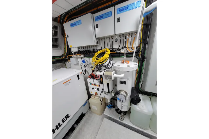 Nana I Yacht Photos Pics Engine room of 2020 Mangusta 110 Open yacht with electrical panels and equipment.