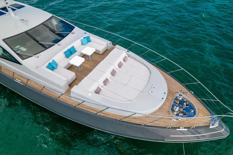 Nana I Yacht Photos Pics Luxury Mangusta 110 Open yacht, 2020 model, with elegant deck seating on turquoise water.