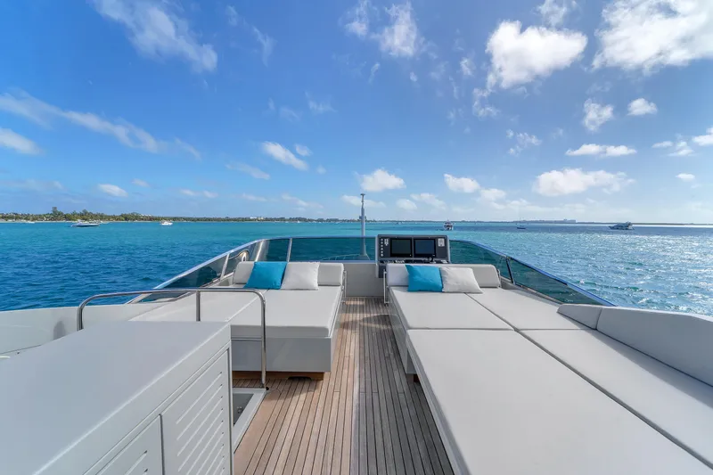 Nana I Yacht Photos Pics Luxurious 2020 Mangusta 110 Open yacht deck with sun loungers and ocean view.