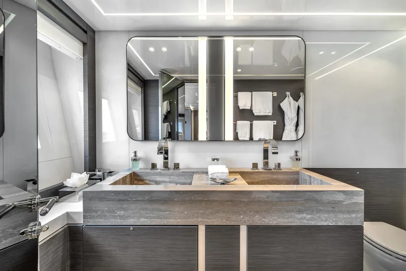 Nana I Yacht Photos Pics Luxurious bathroom in 2020 Mangusta 110 Open yacht, featuring modern double sinks and elegant design.