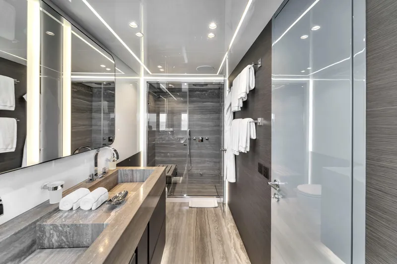Nana I Yacht Photos Pics Luxurious bathroom on 2020 Mangusta 110 Open yacht, featuring modern design and elegant fixtures.