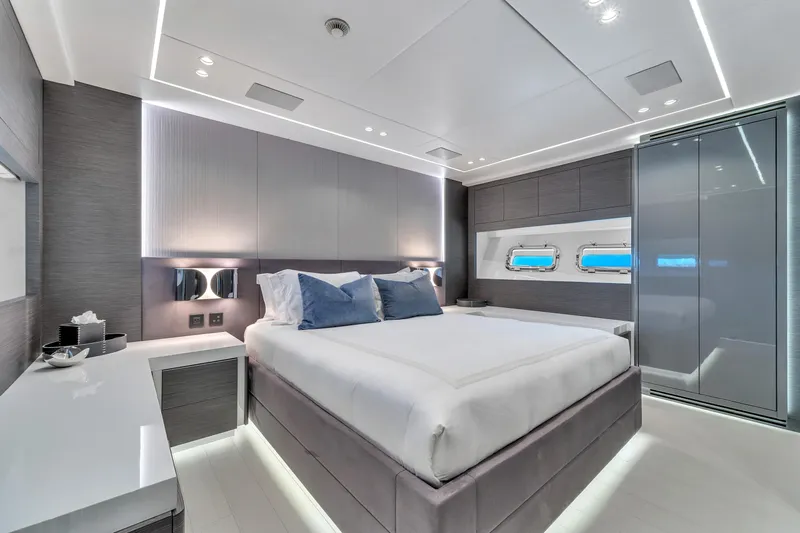 Nana I Yacht Photos Pics Luxurious bedroom interior of 2020 Mangusta 110 Open yacht with modern design and ambient lighting.