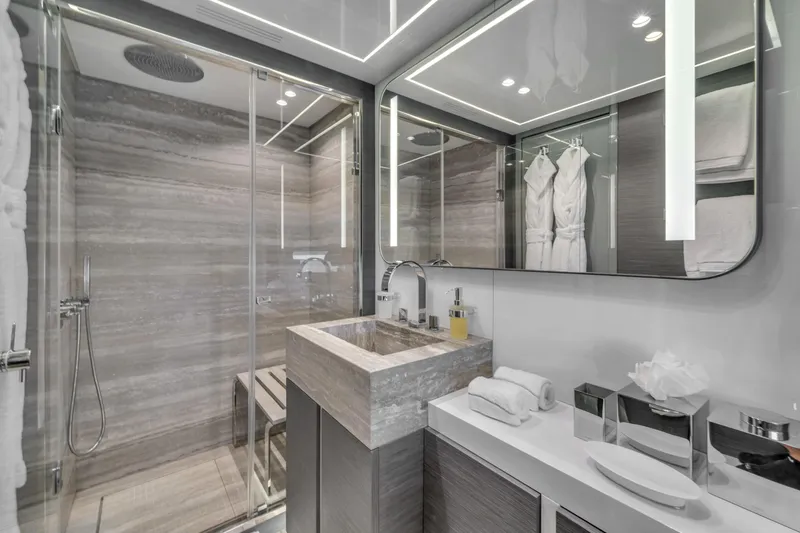 Nana I Yacht Photos Pics Luxurious bathroom on 2020 Mangusta 110 Open yacht with modern fixtures and elegant design.