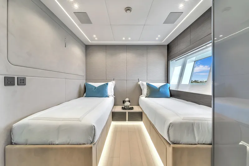 Nana I Yacht Photos Pics Luxurious twin cabin interior on 2020 Mangusta 110 Open yacht, featuring modern design and ocean view.