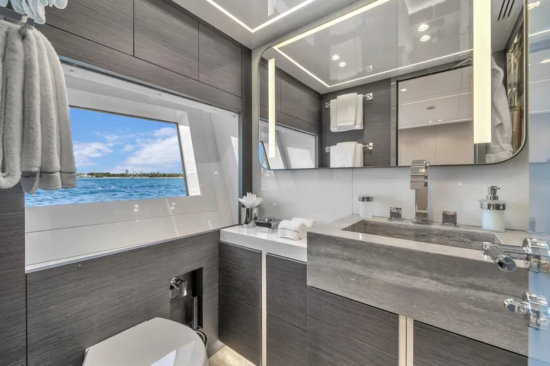Nana I Yacht Photos Pics Luxurious bathroom interior of 2020 Mangusta 110 Open yacht with ocean view.