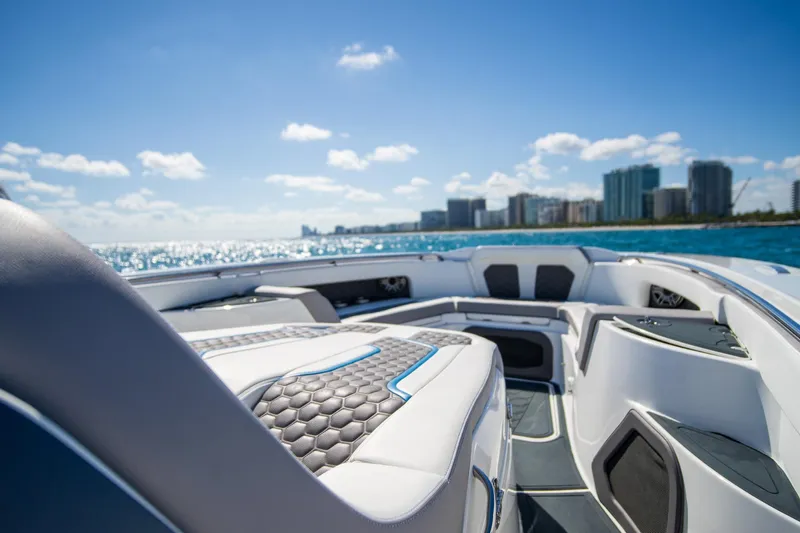  Yacht Photos Pics Luxurious MTI 50v boat interior with city skyline and ocean view, 2023 model.