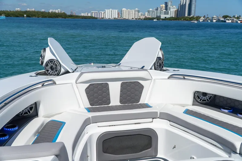  Yacht Photos Pics Luxury MTI 50v 2023 boat interior with speakers, seating, and ocean view.
